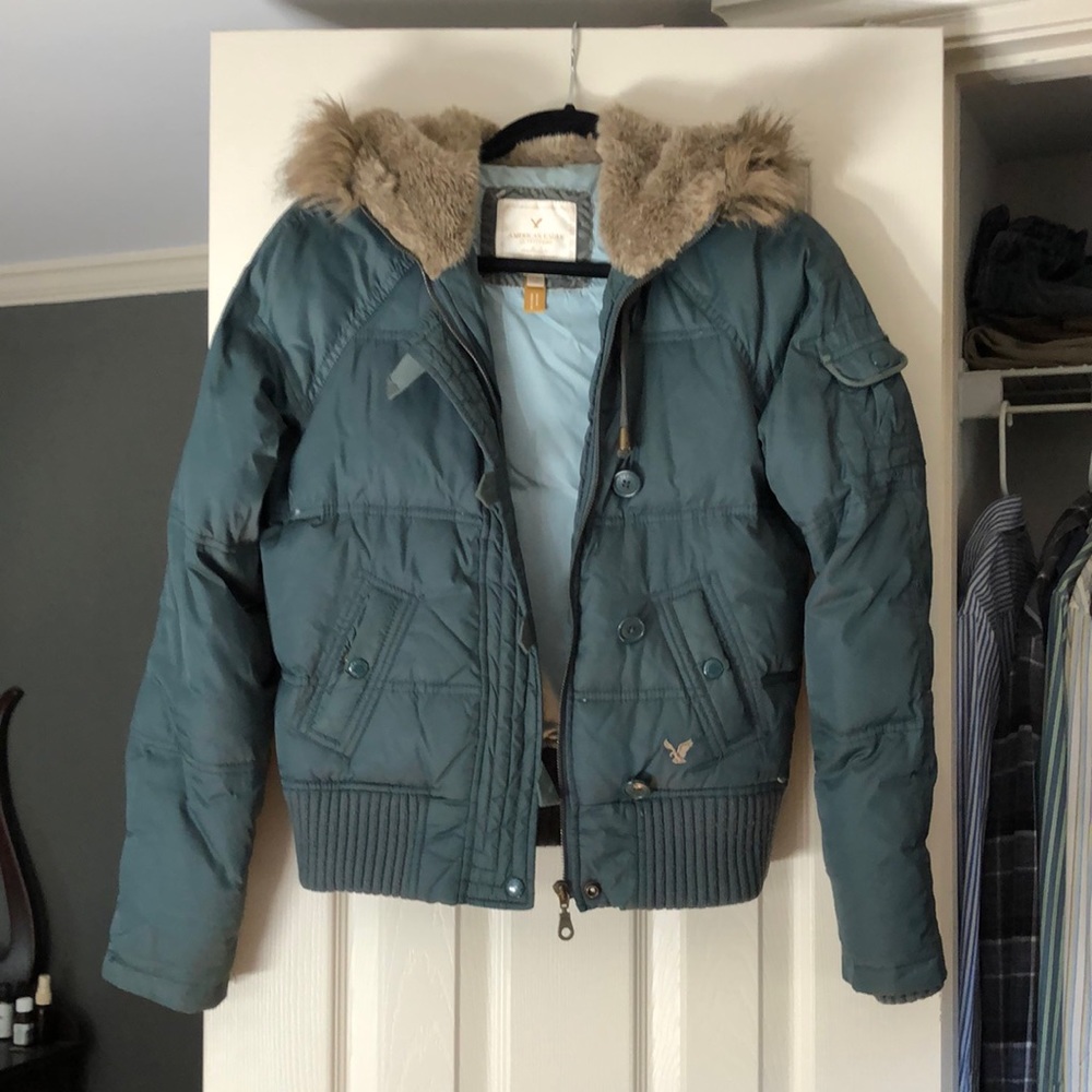 Green, small puffer with fur lined hood.